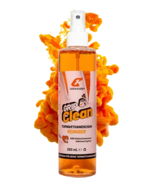 Grip Clean Torwarthandschuh-Reiniger von Catch & Keep: 250-ml-Sprühflasche vor oranger Farbwolke