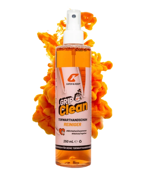 Grip Clean Torwarthandschuh-Reiniger von Catch & Keep: 250-ml-Sprühflasche vor oranger Farbwolke