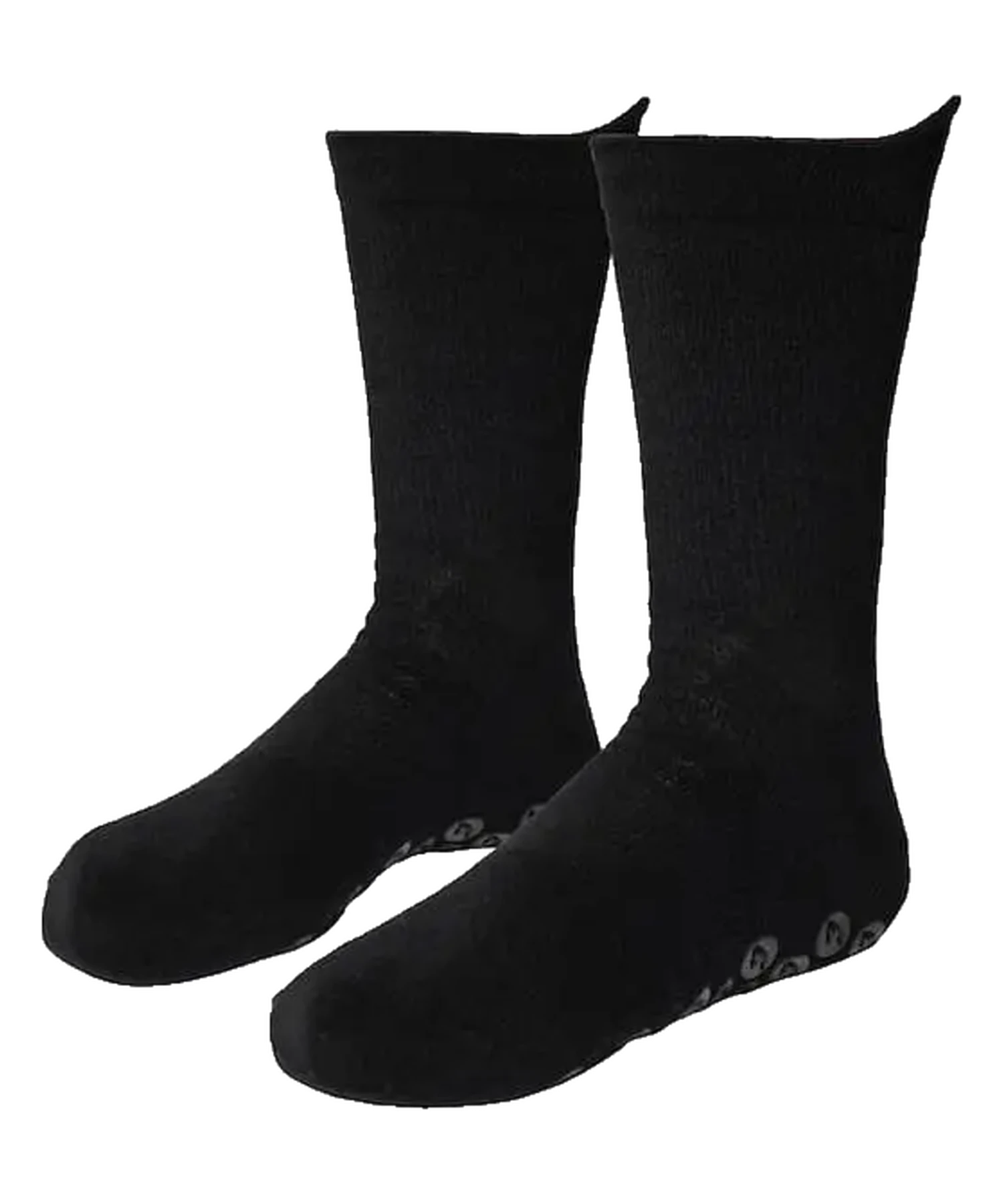 Performance Grip Socke in Schwarz getragen auf dem Rasen – Grip-Elemente an der Sohle sichtbar